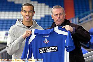 Seb Hines is greeted by assistant boss Tommy Wright. 