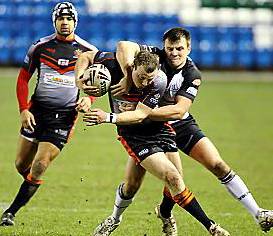 Paul O'Connor is tackled by Widnes' Anthony Thackeray. 