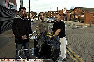 BAGGING up the rubbish... but (from left) Idris Mansoor, Waseem Mahmood and Mike Cattlin have been banned from taking refuse across to the skips in the Tommyfield Market collection area behind them 