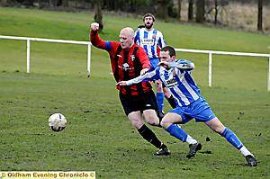 I’M FIRST: Springhead’s Rick Wilde (left) gets to grips with Wythenshawe’s Pat O’Brien. 