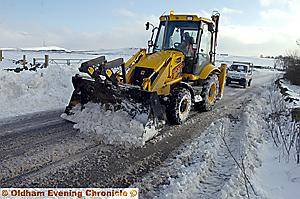 Driving’s hairy from the dairy: Nothing stops the milkround in Scouthead as this delivery driver carefully negotiates the snow drifts and ice — with a helping hand from a farmer’s snowplough in Platting Road, Scouthead.