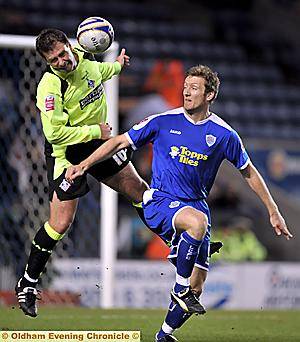Sean Gregan flies into a challenge against Steve Howard 
