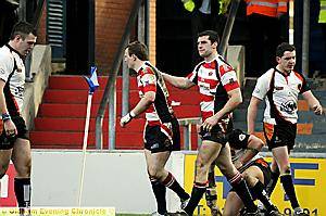 Oldham's Lee Greenwood celebrates the third try 