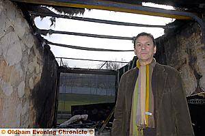 DESTROYED... Tony Spence inside the burned out storage container 