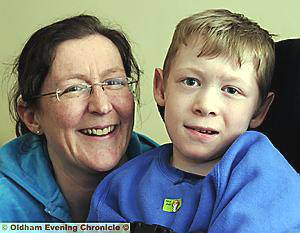 Ten year old Billy Smith with his high tech Eye Gaze computer, with his mum, Julie Carroll at home in Briar Avenue, Watersheddings. Ten year old Billy Smith with his high tech Eye Gaze computer, with his mum, Julie Carroll at home in Briar Avenue, Watersheddings.