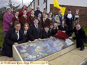 New mosaic made by pupils from South Chadderton School unveiled at the junction of Middleton Road and Broadway, Chadderton. Pic shows stand-in town crier Michael Lawson (standing right), pupils from South Chadderton and St. Herbert's Schools (St. Herbert's planted trees and bulbs) and Cllr. Phil Rogers (right) unveiling artwork. New mosaic made by pupils from South Chadderton School unveiled at the junction of Middleton Road and Broadway, Chadderton. Pic shows stand-in town crier Michael Lawson (standing right), pupils from South Chadderton and St. Herbert's Schools (St. Herbert's planted trees and bulbs) and Cllr. Phil Rogers (right) unveiling artwork.