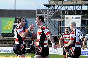 ROBERT ROBERTS (right) celebrates his try with the impressive Danny Halliwell. 