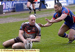 Andy Ballard crosses for an Oldham try.