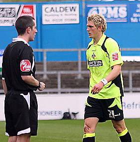 I WANT A WORD WITH YOU: Referee Kevin Wright calls over Daniel Jones at the Carlisle game.