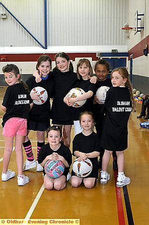 SCHOOL holiday fun . . . youngsters from Hulme Estcourt, Hodge Clough, Firwood Manor and Delph Primary at the netball camp 