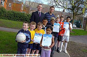 GAME on . . . Chadderton FC Juniors chairman Peter Hamilton (left) and Radclyffe school sports co-ordinator Liam Roberts with pupils (from left) Kyle Lord, Tate Campbell, Finlay Hurst, Abas Ali, Habiba Akhtar, Kamran Mohammed, Nathan Phelan, Aaron O’Brien and Adil Wahid GAME on . . . Chadderton FC Juniors chairman Peter Hamilton (left) and Radclyffe school sports co-ordinator Liam Roberts with pupils (from left) Kyle Lord, Tate Campbell, Finlay Hurst, Abas Ali, Habiba Akhtar, Kamran Mohammed, Nathan Phelan, Aaron O’Brien and Adil Wahid