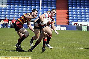 Oldham’s Luke Menzies tries to break through the Dewsbury defence. 