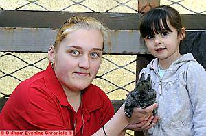 Pennine Pen volunteer Gemma Slater with Courtney Malloy (3) and a baby rabbit
