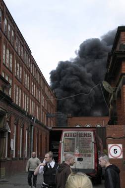 WORKERS evacuate as the fire starts to grip the mill. Picture by reader Andrew Brunton 

