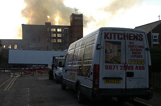 The scene early this morning as the blaze's destruction became clear 