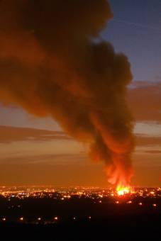 The orange glow of the blaze coloured the night sky