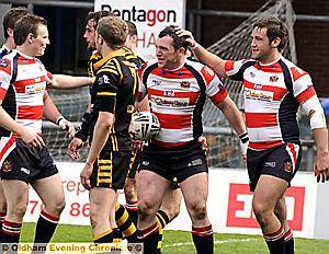 Oldham's Tommy Goulden celebrates after his 67th-minute try 