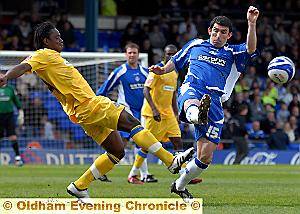 THAT’S THE SPIRIT . . . Kevin Maher (right) shows his determination in the heart of the Athletic midfield. 