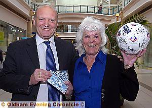 CONGRATULATIONS . . . centre manager Mike Flanagan presents Eileen Florence with her prize CONGRATULATIONS . . . centre manager Mike Flanagan presents Eileen Florence with her prize