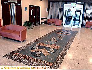 LOOKING tatty . . . the foyer and cracked mosaic
LOOKING tatty . . . the foyer and cracked mosaic