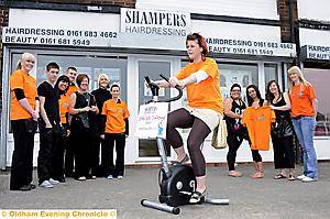 Diane Johnson gets on her bike with staff and customers at Shampers, Lord Lane, Failsworth for charity Diane Johnson gets on her bike with staff and customers at Shampers, Lord Lane, Failsworth for charity