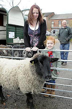 Animal Farm comes to the RSPCA in Oldham, Collette Johnson and daughter Gracie Johnson ( 5 yrs ) meet a sheep from Pimhole Community Farm, Bury Animal Farm comes to the RSPCA in Oldham, Collette Johnson and daughter Gracie Johnson ( 5 yrs ) meet a sheep from Pimhole Community Farm, Bury