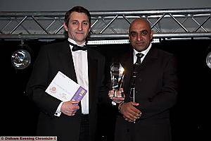 BUSINESSMAN: Rod Boyes (left) collects Martin Littler’s award from Mohammed Rahim, chairman of the Asian Business Association. 