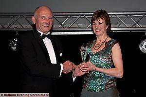 LIFETIME ACHIEVEMENT: David Bellis’ daughter Wendy Bellis receives the award from sponsor Frank Rothweell 