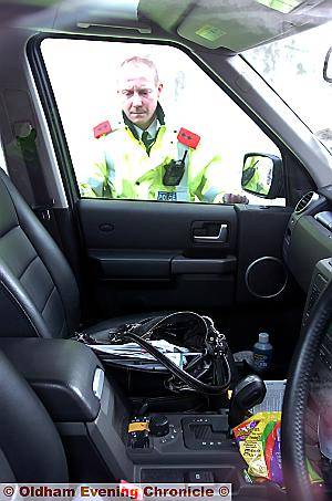 OPEN invitation . . . Insp Danny Milovanovic sees an open handbag in full view
