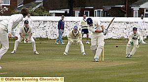 THE Greenfield slip cordon waits as Moorside skipper Francis Sutherland tries to work the ball away.