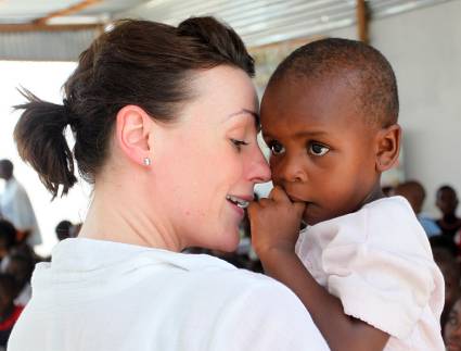 Suranne shares a quiet moment with a toddler. Picture courtesy Christian Aid/ Lee Thompson. 
