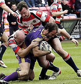GOTCHA! Roughyeds dump Neil Roden (left) and Rob Roberts wrestle Gateshead Thunder’s Sam Crowther to the ground.