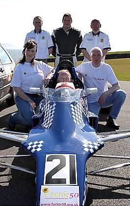 ON your marks . . . Factor 50 fund-raisers Gillian Nuttall and Andy Worthington with some of the drivers and marshals from Formula Ford NW ON your marks . . . Factor 50 fund-raisers Gillian Nuttall and Andy Worthington with some of the drivers and marshals from Formula Ford NW