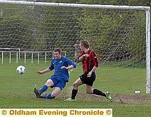 IT’S THERE: Johnny Thompson scores for Crompton House against Oldham Sixth Form College. 
