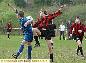 I’M BEHIND YOU: Carl Caffrey (left), of Oldham Sixth Form College, and Crompton House’s Sean Pilling battle for the ball.
