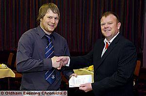 David Sweeney (left) receives his award from Iain Taylor (Rugby Oldham Chairman) 