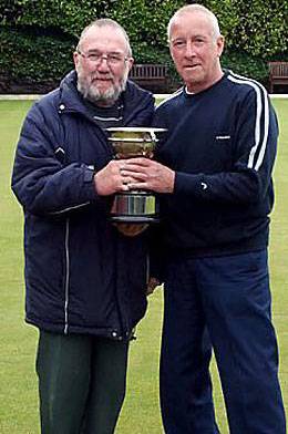 Farrow Cup winner Lance Greenwood (Springbank) receives the trophy from Veterans League chairman Bryan O’Neill (left). Farrow Cup winner Lance Greenwood (Springbank) receives the trophy from Veterans League chairman Bryan O’Neill (left).