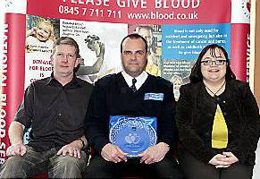 PICTURED at the ceremony: Paul Carty, PCSO Gary Etchells and Lisa Fletcher PICTURED at the ceremony: Paul Carty, PCSO Gary Etchells and Lisa Fletcher