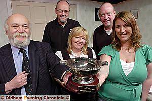 Pictured with the trophy are (from the left) Tony Adler, panto actors Tony Mooney, Carole Griffiths and Tony Cenci, and director Rebecca Henry 