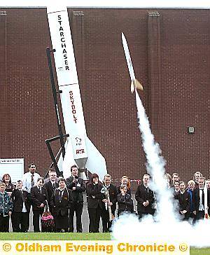 We have lift off! The students watch as a rocket soars into the sky 