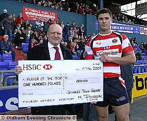 CONGRATULATIONS: Spindles and Town Square manager Mike Flanagan (left) presents Roughyeds star Dave Allen with his prize. CONGRATULATIONS: Spindles and Town Square manager Mike Flanagan (left) presents Roughyeds star Dave Allen with his prize.
