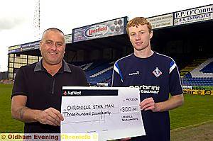 CHRIS TAYLOR is pictured (right) receiving his cheque from Eddy Benedek (Leesfield). CHRIS TAYLOR is pictured (right) receiving his cheque from Eddy Benedek (Leesfield).