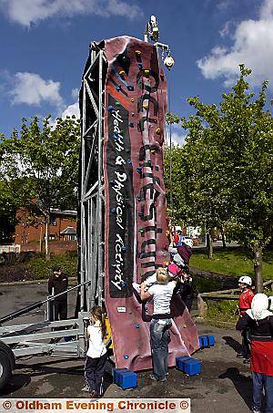 ONE step at a time . . . youngsters on the mobile wall 