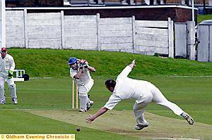 Royton’s Ryan Carters puts one past Crompton bowler Simon Wright. 