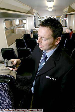 TRAINING SESSION . . . Conductor Steven Lewis using his new Blackberry handset in York TRAINING SESSION . . . Conductor Steven Lewis using his new Blackberry handset in York