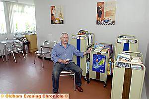 Disgruntled . . . Councillor Dave Hibbert shows off the less-than adequate temporary library provision Disgruntled . . . Councillor Dave Hibbert shows off the less-than adequate temporary library provision