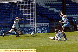 Jake Massey slides in to score for South Chadderton in the Year 10 final against Crompton House. 
