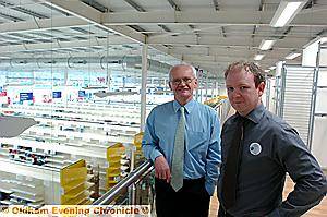 EXTRA HELP . . . Tesco Extra store manager Dominic Carey with Chronicle editor Jim Williams inside the emerging new Huddersfield Road store. EXTRA HELP . . . Tesco Extra store manager Dominic Carey with Chronicle editor Jim Williams inside the emerging new Huddersfield Road store.