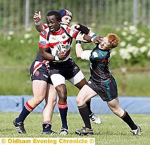 Lucas Onyengo hands off Graeme Spencer of London Skolars 
