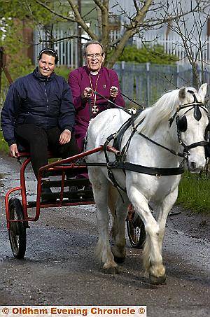 GIDDY up . . . the Bishop of Manchester takes the reigns on a horse and cart with Trent Riding Stables proprietor Esme Hernon 